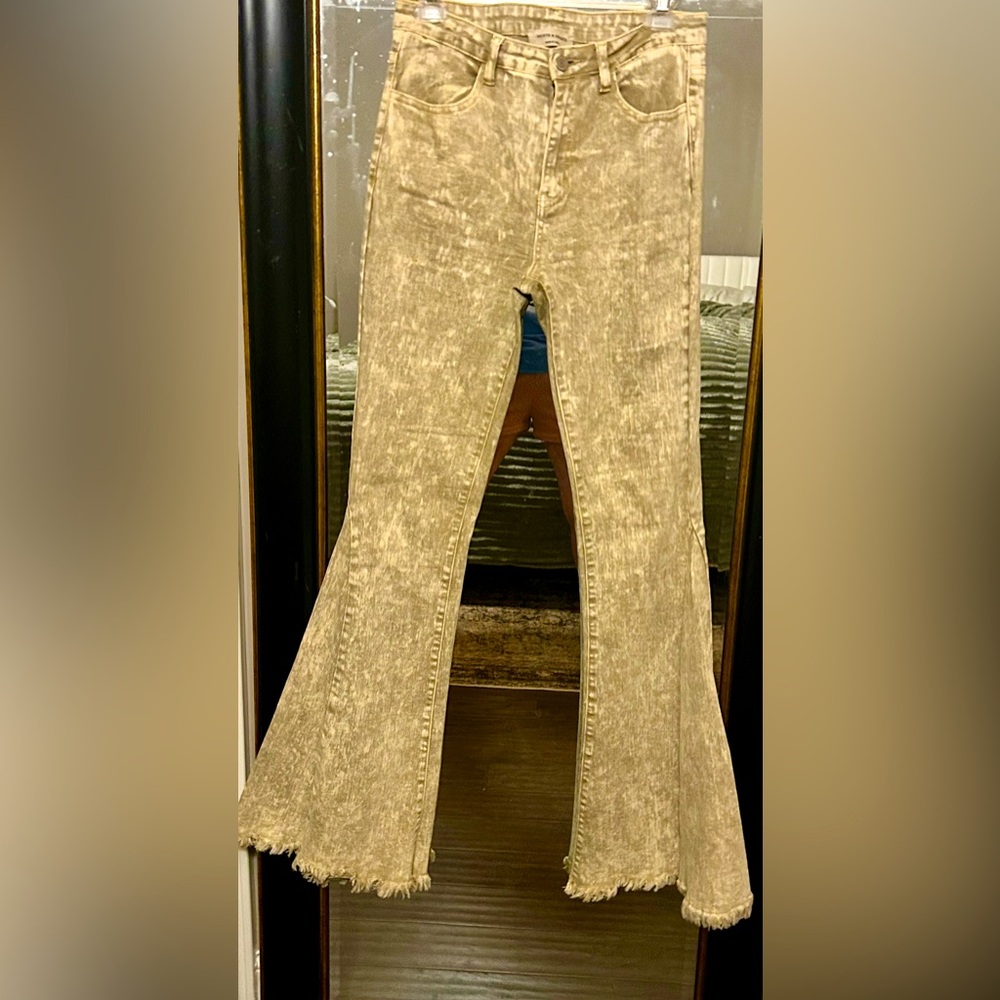 Saints & Hearts high rise jeans that feature an exaggerated flare leg.